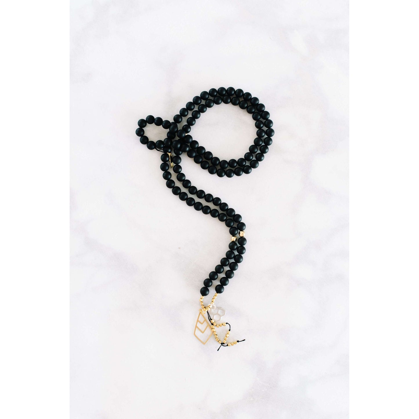 Yin Yang Mala - Mala & Me- Gemstones with beautiful geometric pendents inspired by nature- Jewlery used for meditation, setting intentions and enhancing your yoga practice. Each gemstone holds unique healing properties